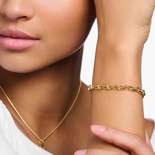 Woman Wearing Thomas Sabo Gold Classic Belcher Charm Bracelet