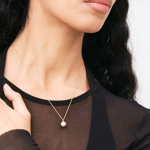 Woman Wearing Daniel Wellington Pave Crystal Gold Ball Necklace