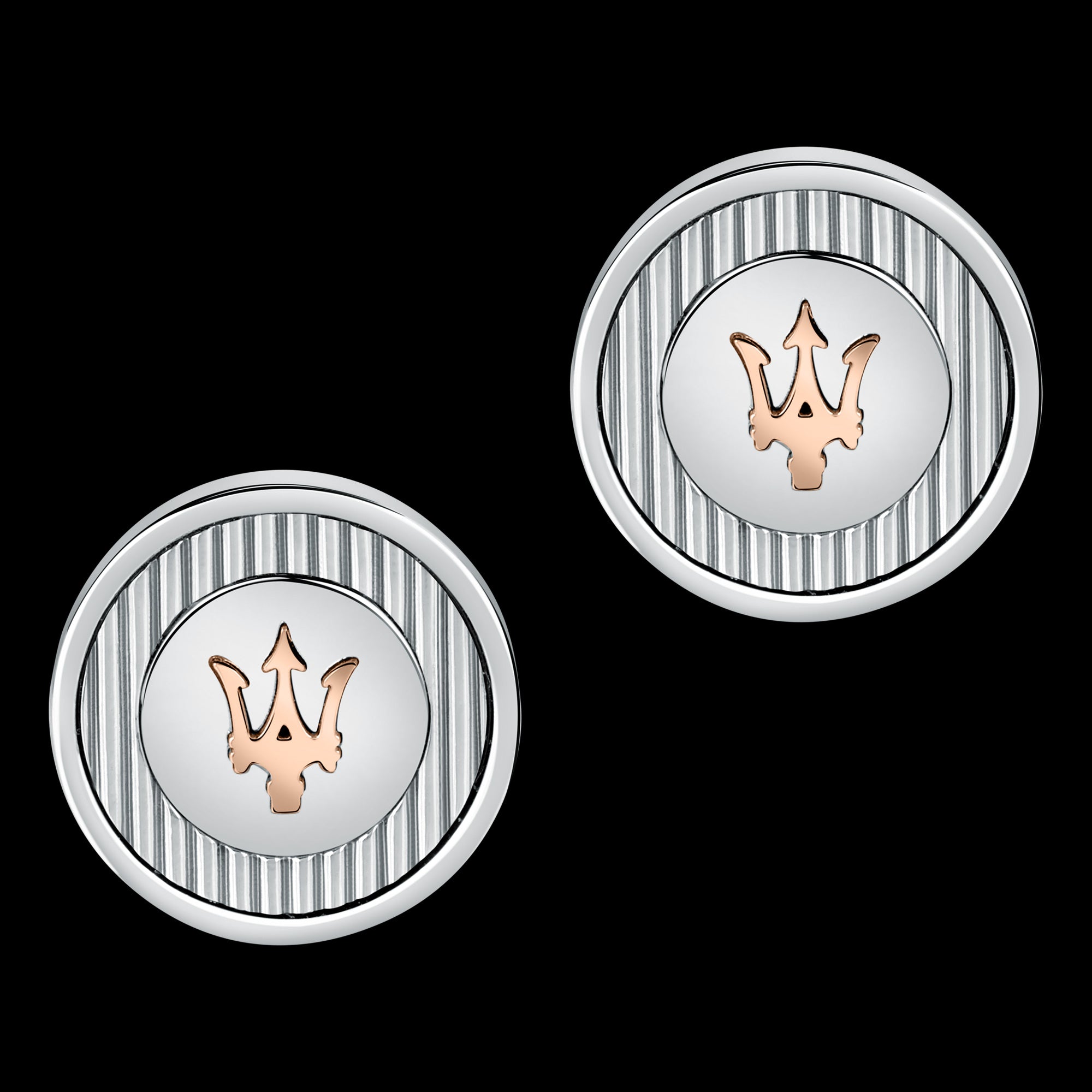 A pair of silver and rose gold Maserati cufflinks with the brand's logo in the centre.