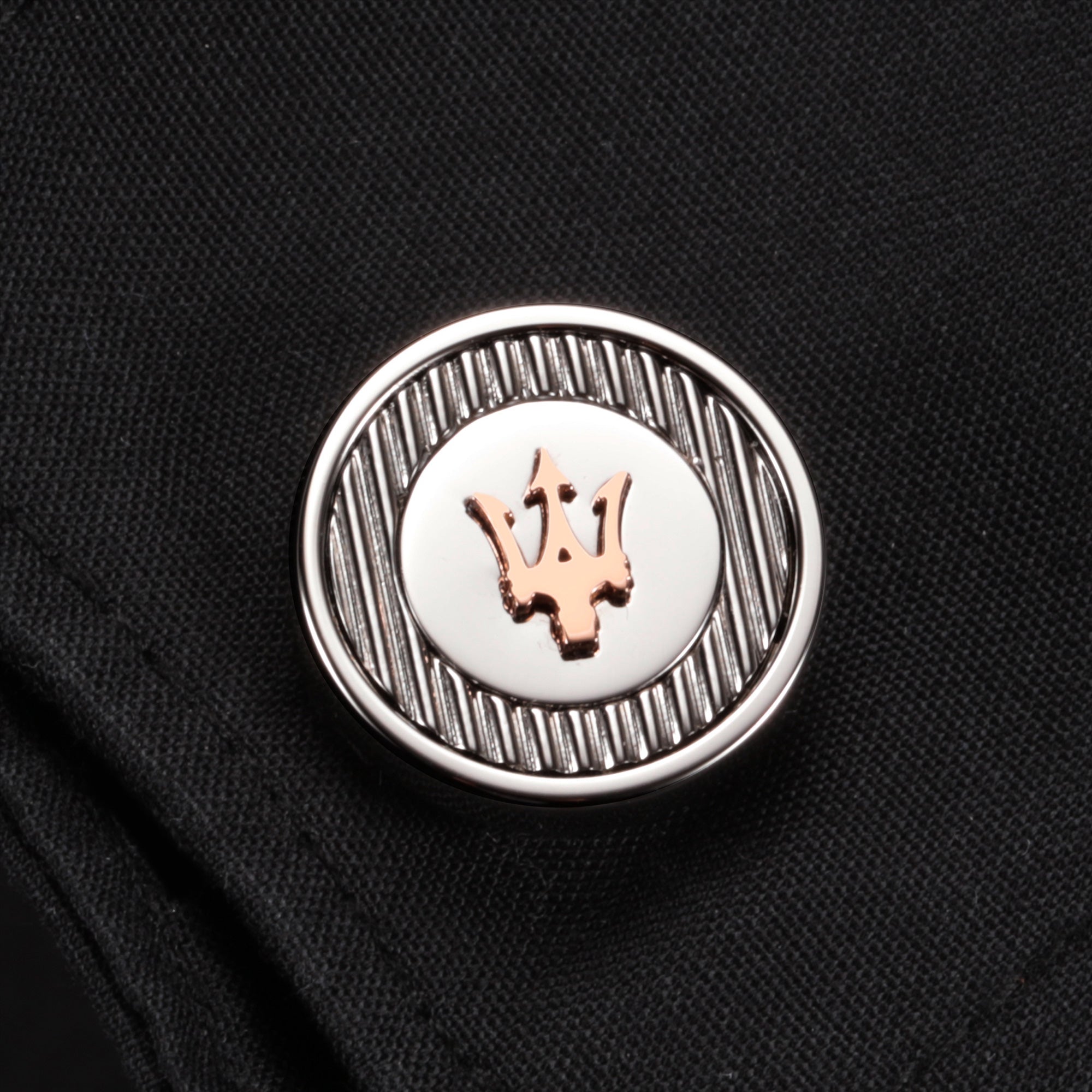 Close-Up Of A Maserati Logo Cufflink
