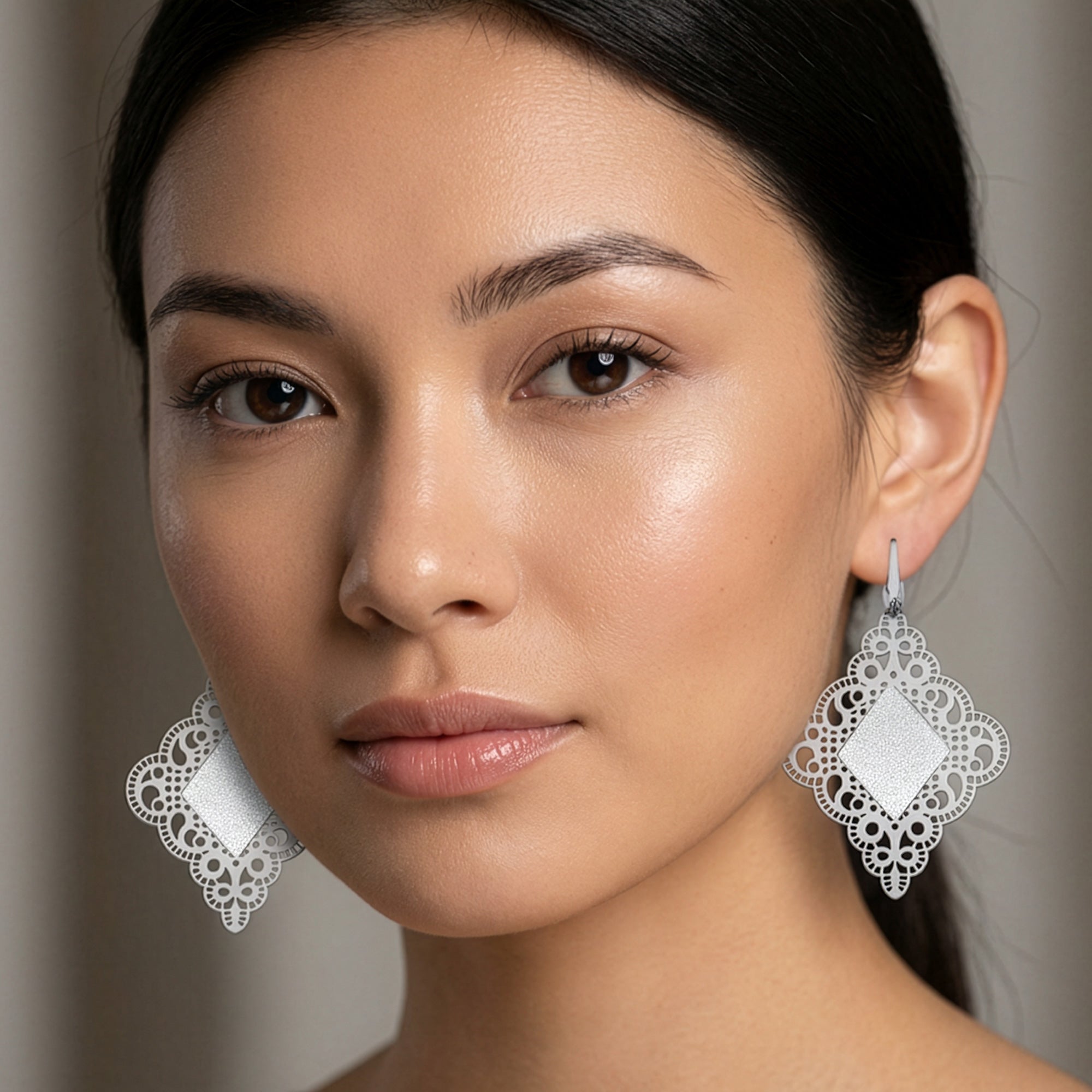 Woman Wearing Tesoro Sterling Silver Diamond Filigree Earrings