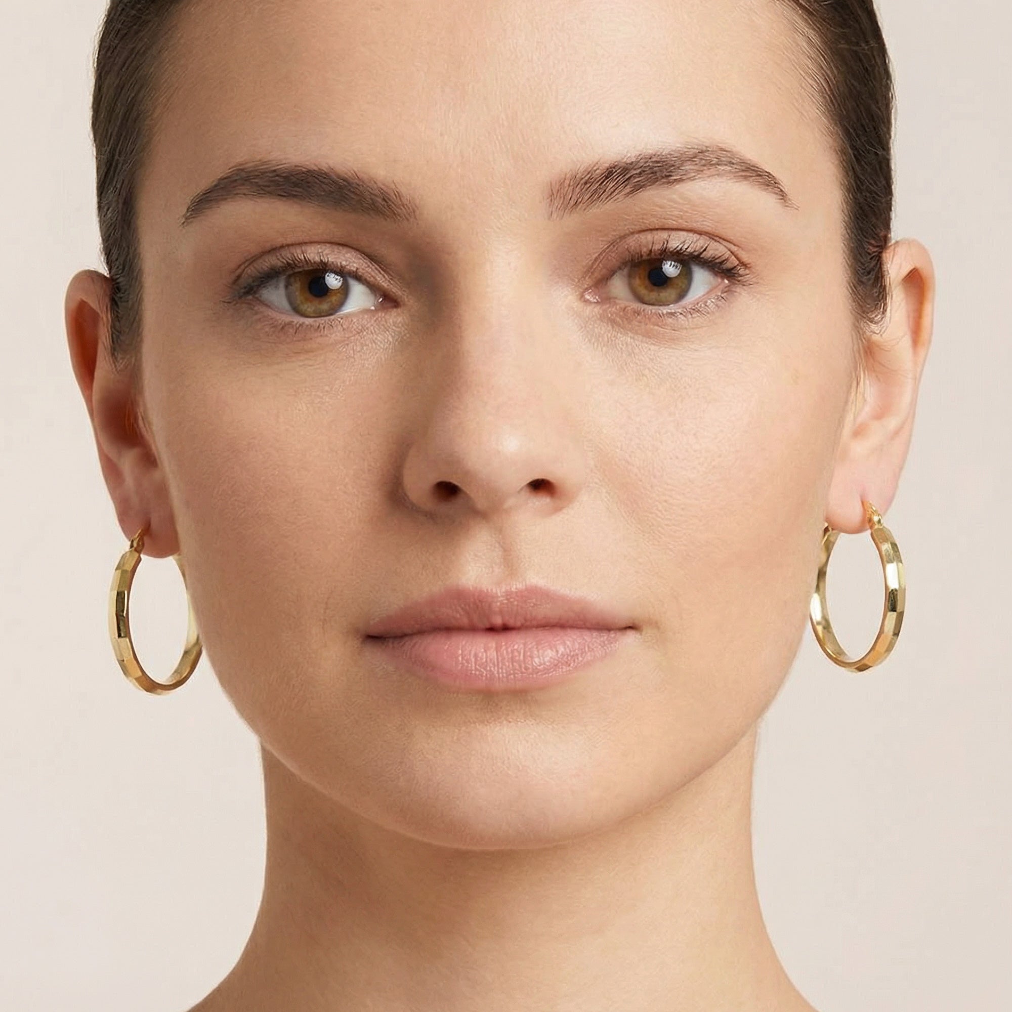 Woman Wearing Tesoro Italian 9 Carat Gold Bevel Edge Hoop Earrings