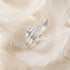 Engelsrufer Silver Adjustable Angel Wing Ring Laying On White Feathers
