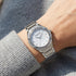 Woman Wearing Kenneth Cole Silver Mother Of Pearl Gem Halo Ladies Watch