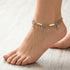 Woman Wearing Triangles Gold Boho Bead Anklet