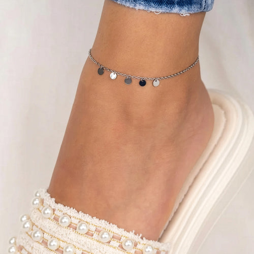 Woman Wearing Shimmering Disc Charm Steel Anklet