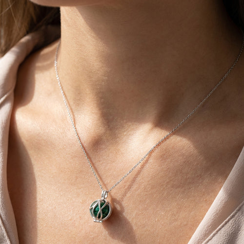 Woman Wearing Malachite Infinity Cage Sterling Silver Necklace