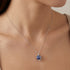 Woman Wearing Lapis Lazuli Infinity Cage Silver Necklace | Engelsrufer Australia