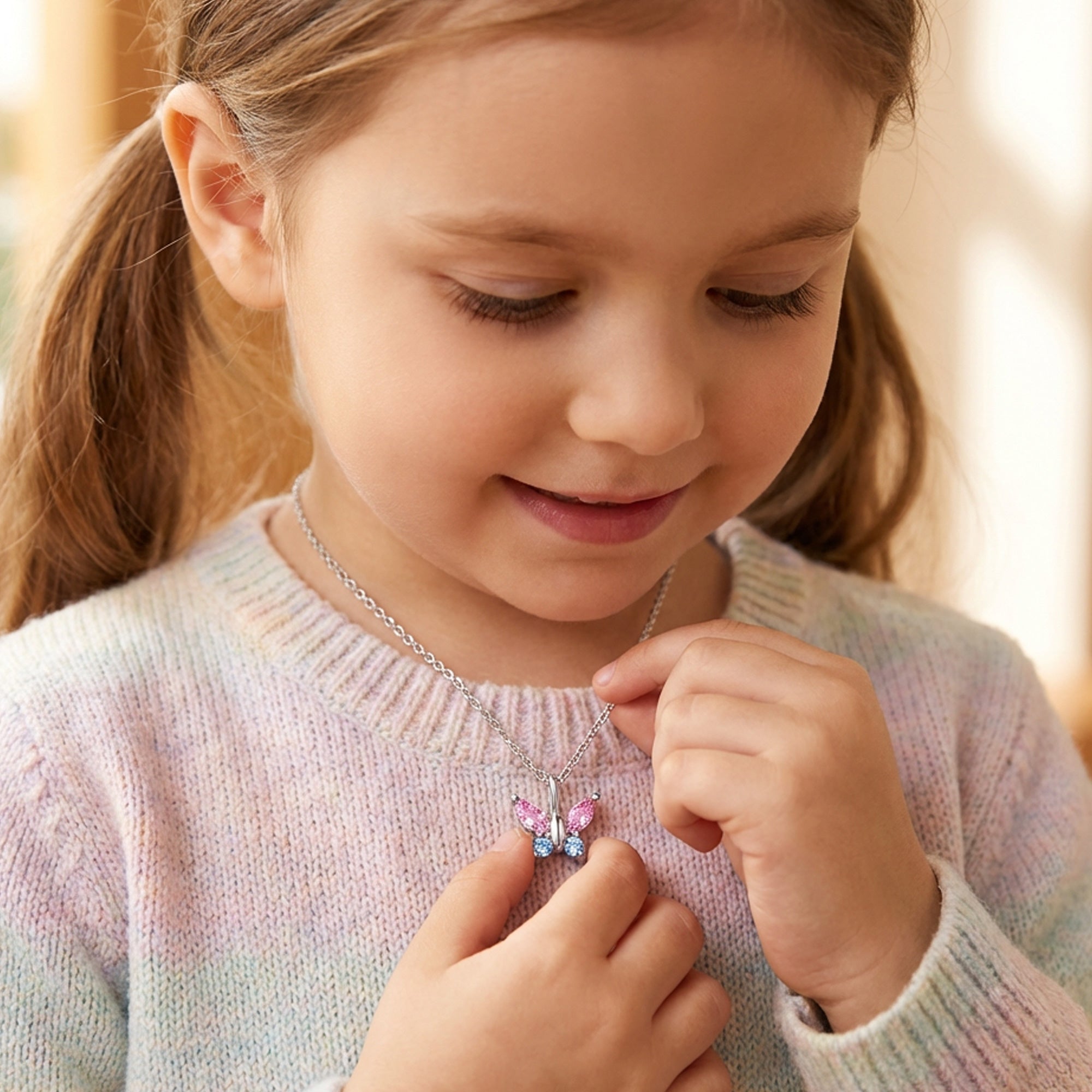 Young Girl Wearing Butterfly Pink & Blue CZ Children's Necklace