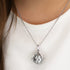 ENGELSRUFER SILVER WHITE PEARL ANGEL WING SOUNDBALL PENDANT - MODEL VIEW