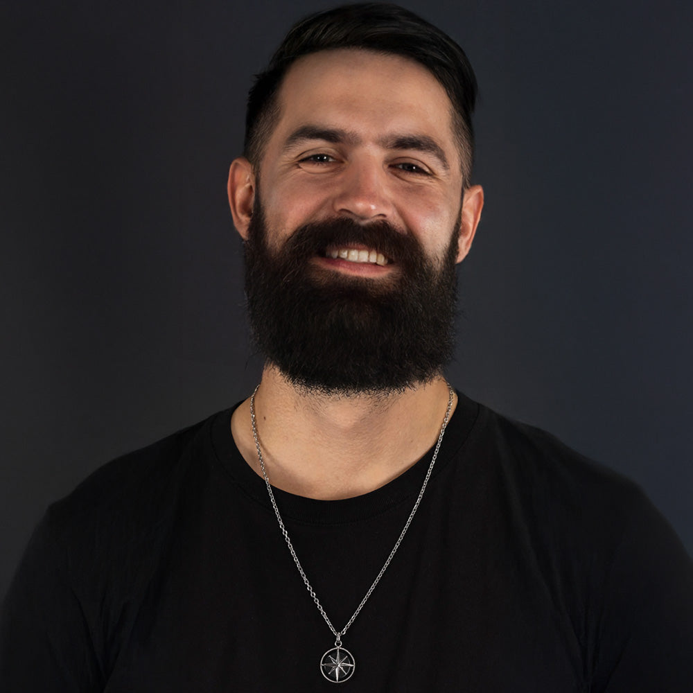 Man Wearing Black Onyx Compass Talisman Men's Necklace | Save Brave Australia