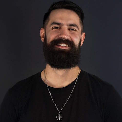 Man Wearing Black Onyx Compass Talisman Men's Necklace | Save Brave Australia