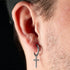 Man Wearing Steel Dangle Cross Men’s Hoop Earring