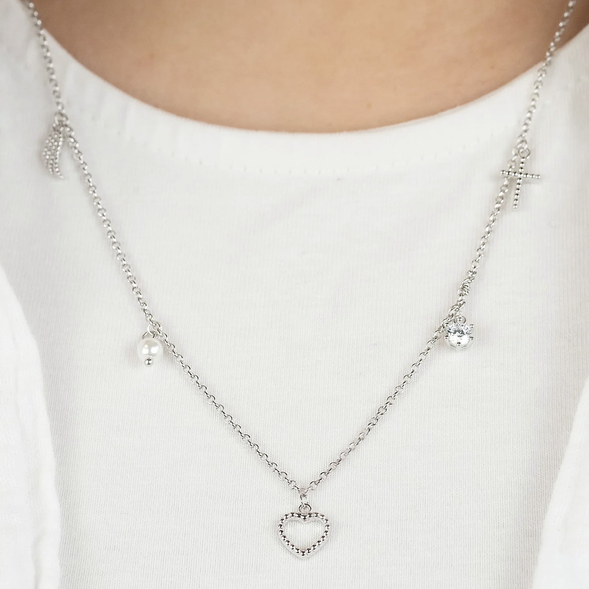 Woman Wearing Heart Charm Close Up Sterling Silver Faith Love Hope Charm Necklace