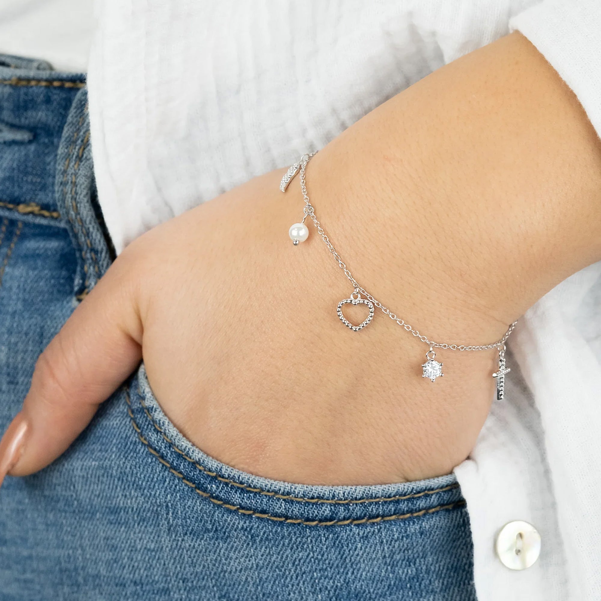 Woman wearing Sterling Silver Faith Love Hope Charm Bracelet