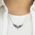 Woman Wearing Sterling Silver Flying Angel Ocean Blue Necklace