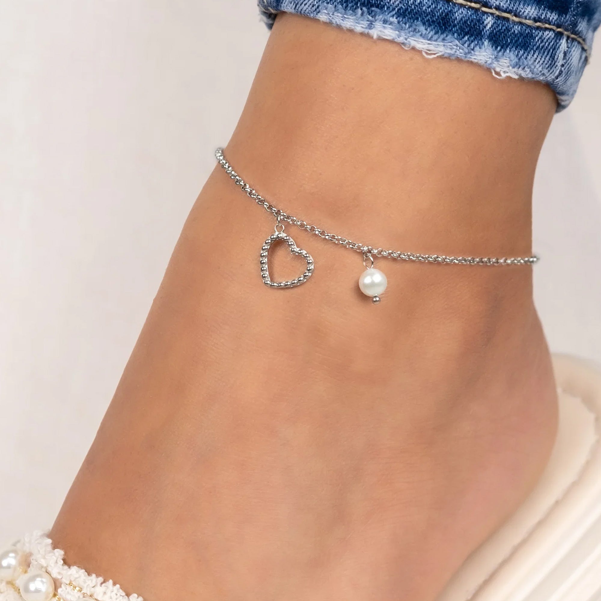 Woman Wearing Stainless Steel Heart & Pearl Anklet