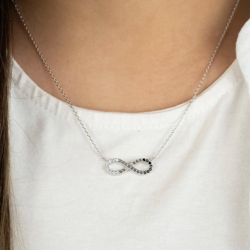 Woman Wearing Sterling Silver Dark Shade Infinity CZ Necklace
