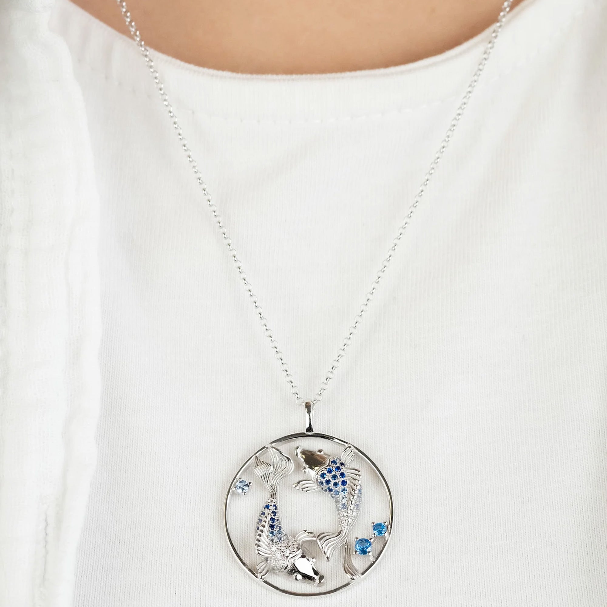 Woman Wearing Sterling Silver Koi Fish Ocean Blue Yin Yang Balance Necklace