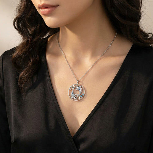 Woman In Black Dress Wearing Sterling Silver Koi Fish Ocean Blue Yin Yang Balance Necklace