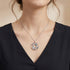Woman Wearing Sterling Silver Koi Fish Ocean Blue Yin Yang Balance Necklace
