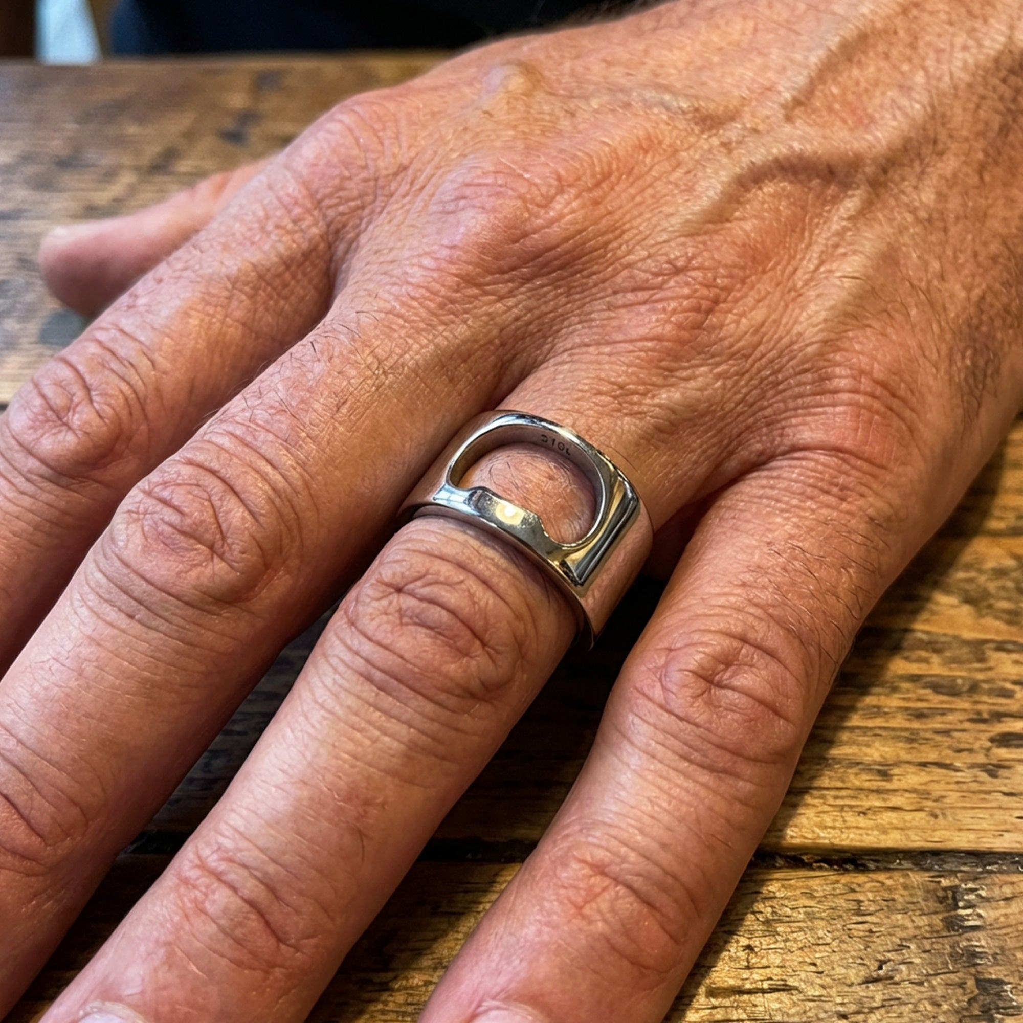 Man Wearing Stainless Steel Bottle Opener Ring