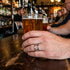 Man Wearing Stainless Steel Bottle Opener Ring At The Pub