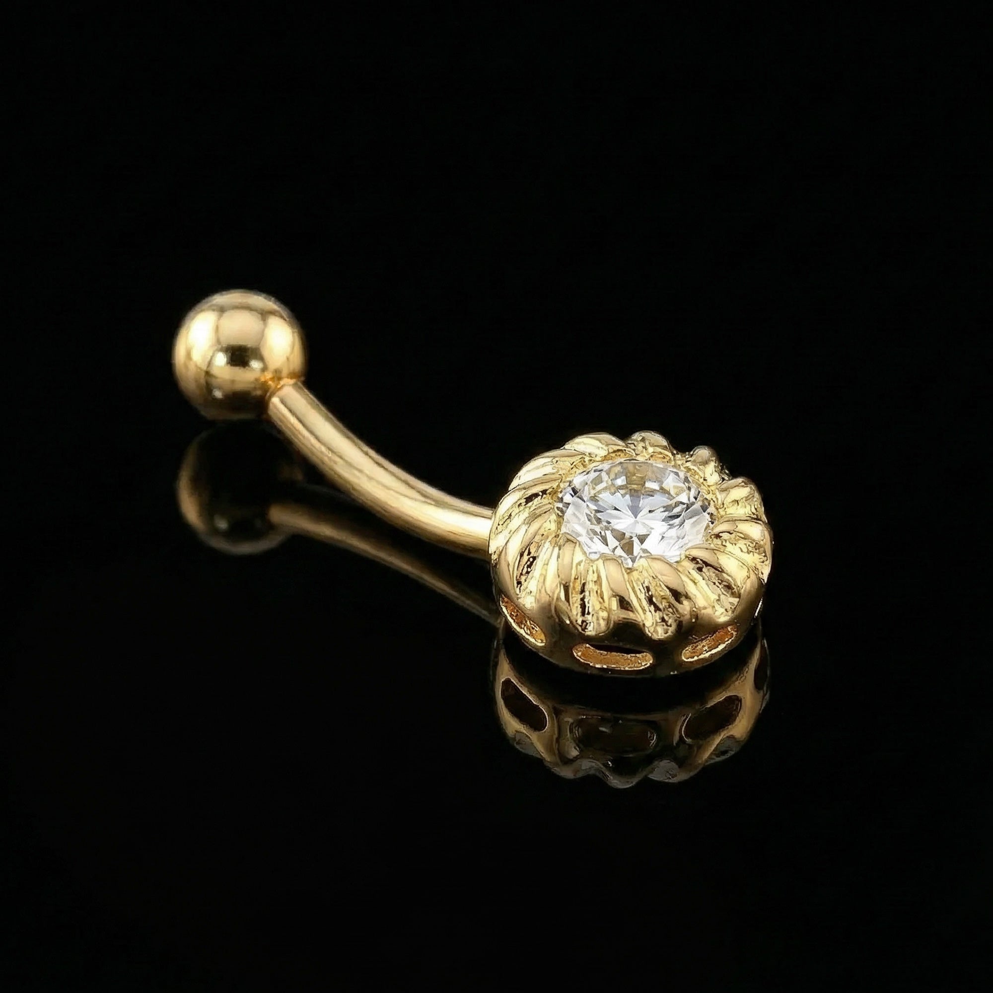 14 Carat Solid Gold CZ Belly Bar Piercing On Black Mirror Surface