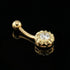 14 Carat Solid Gold CZ Belly Bar Piercing On Black Mirror Surface