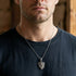 Close Up Man Wearing Stainless Steel Men's Battle Flames Shield Necklace
