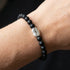 Woman wearing Anchor & Crew coffee bean silver black agate stone bracelet