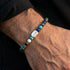 Man wearing Anchor & Crew coffee bean silver multi-stone bracelet