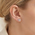 Woman wearing Engelsrufer Arabesque heart filigree silver stud earrings.