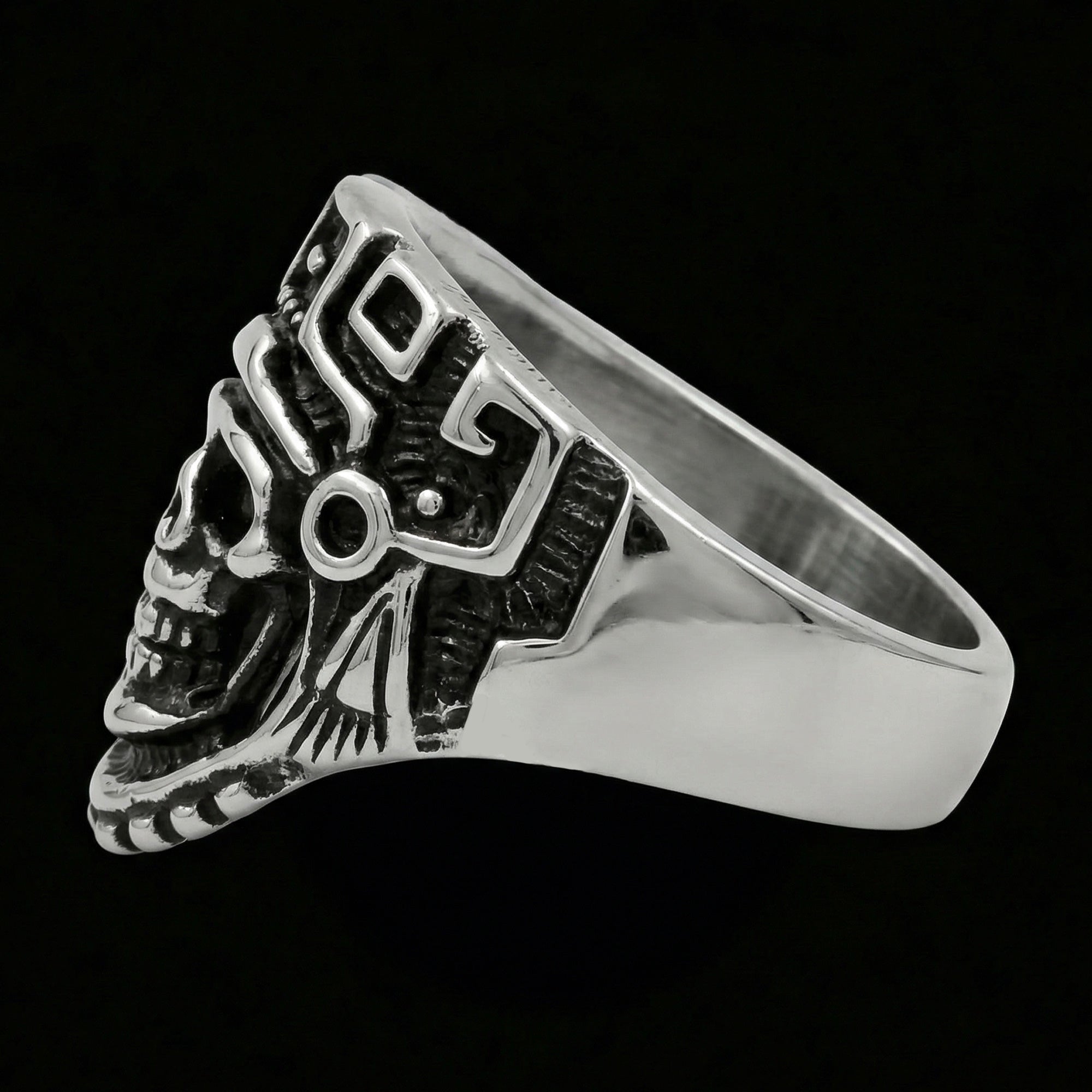 Side view of stainless steel men's skull Aztec death mask ring facing left.