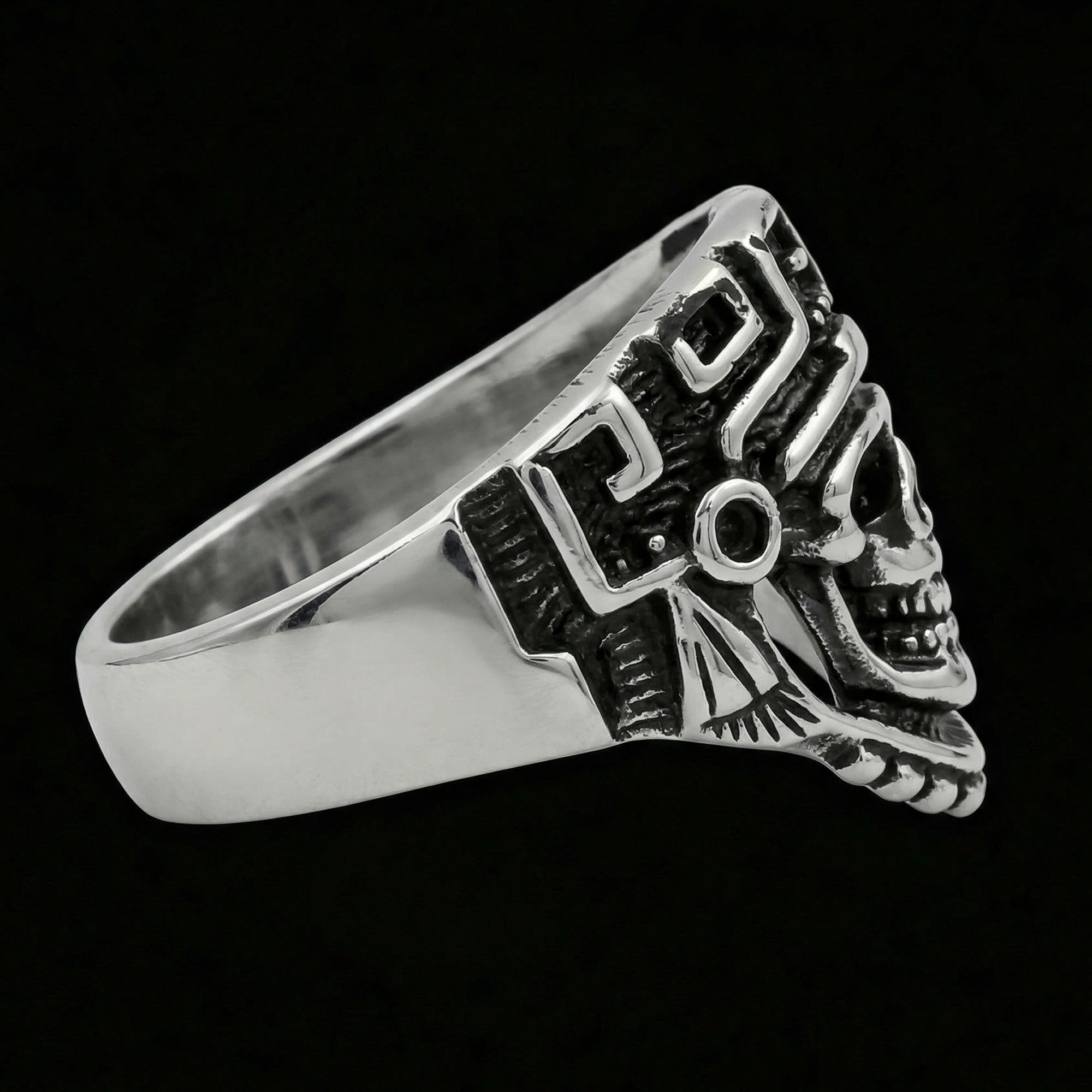 Side view of stainless steel men's skull Aztec death mask ring facing right.