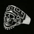 Tilted angle of stainless steel men's skull Aztec death mask ring.