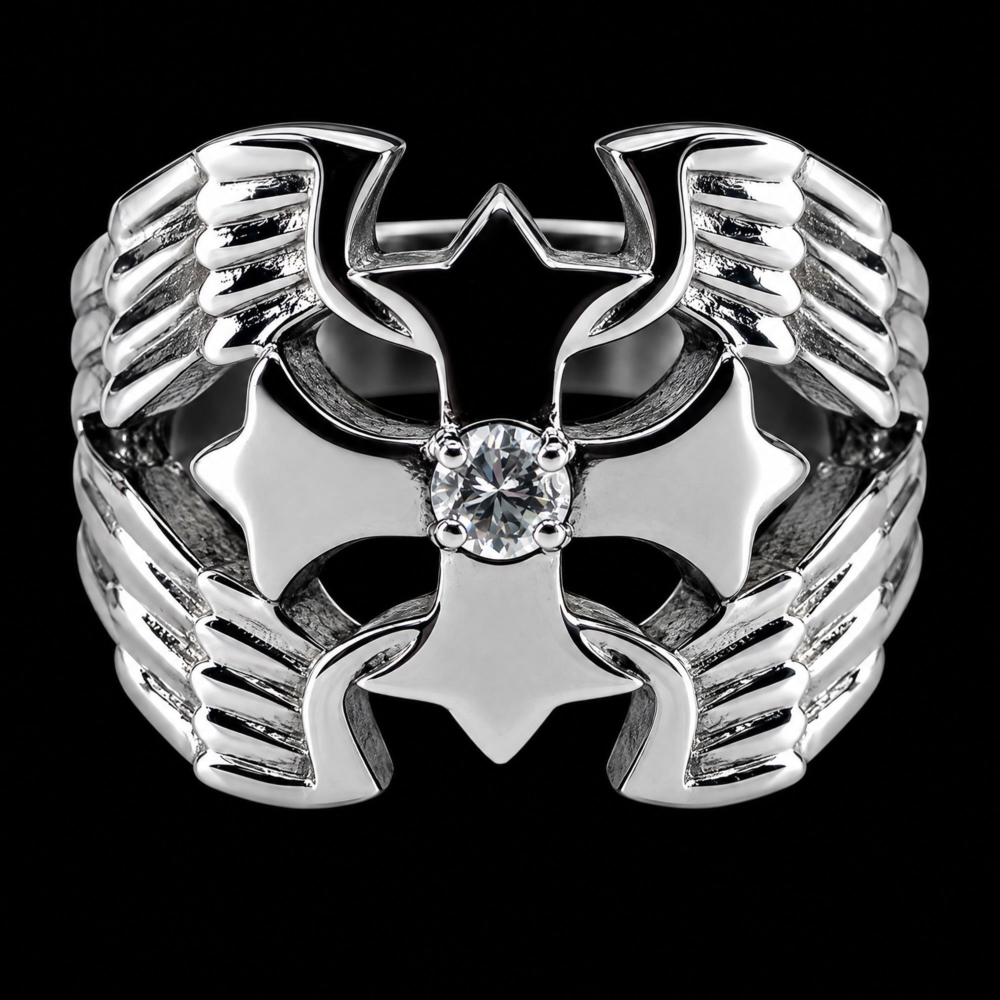 Front view of a winged barbed cross stainless steel men's ring.