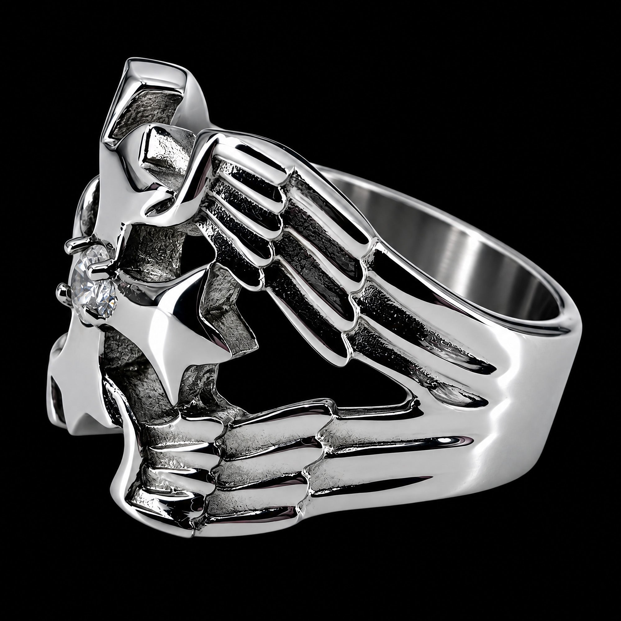 Side view of a winged barbed cross stainless steel men's ring facing left.