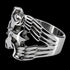 Side view of a winged barbed cross stainless steel men's ring facing left.