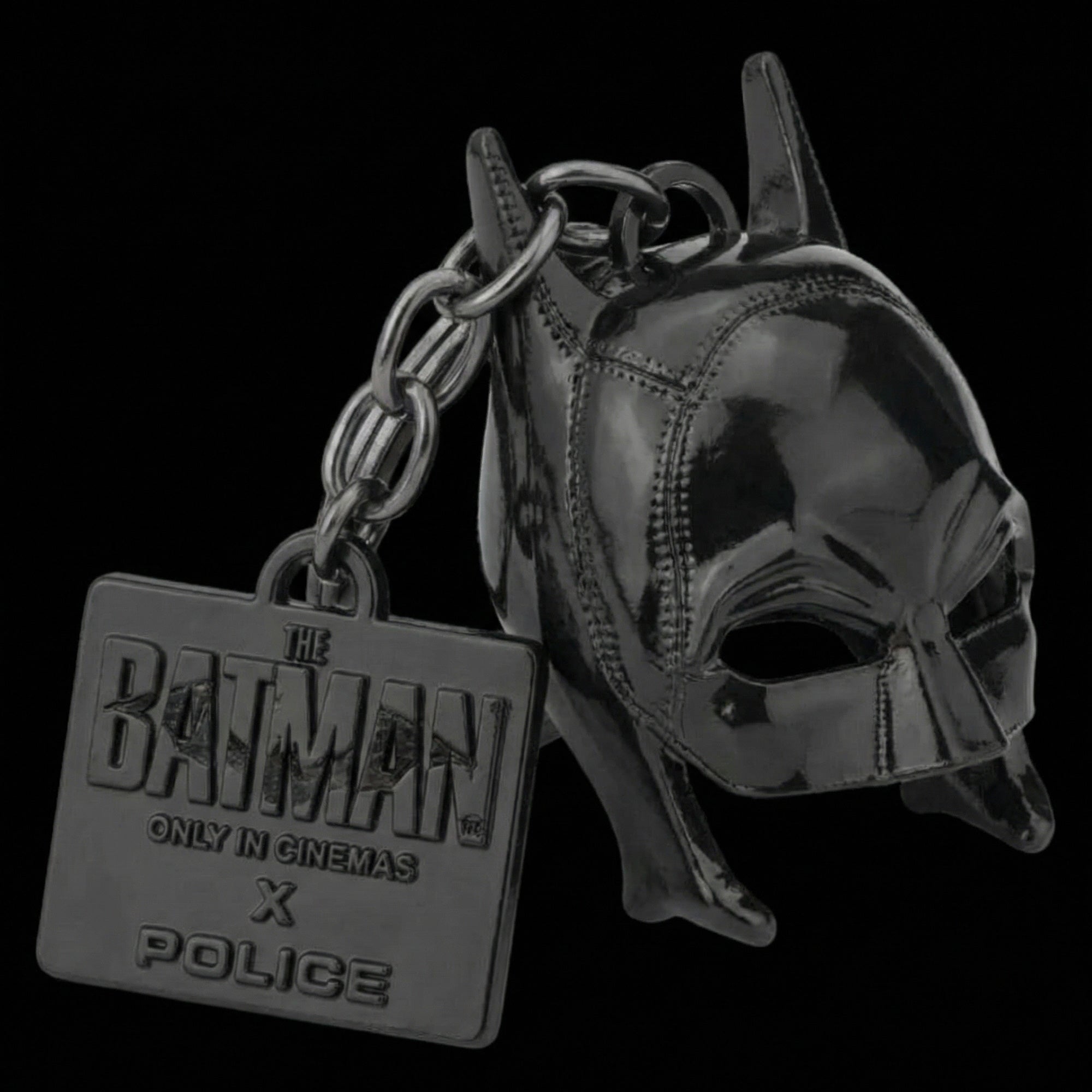 Close-up of Batman cowl mask black steel keyring.