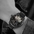 Man wearing Batman Dark Knight Police mechanical limited edition watch.
