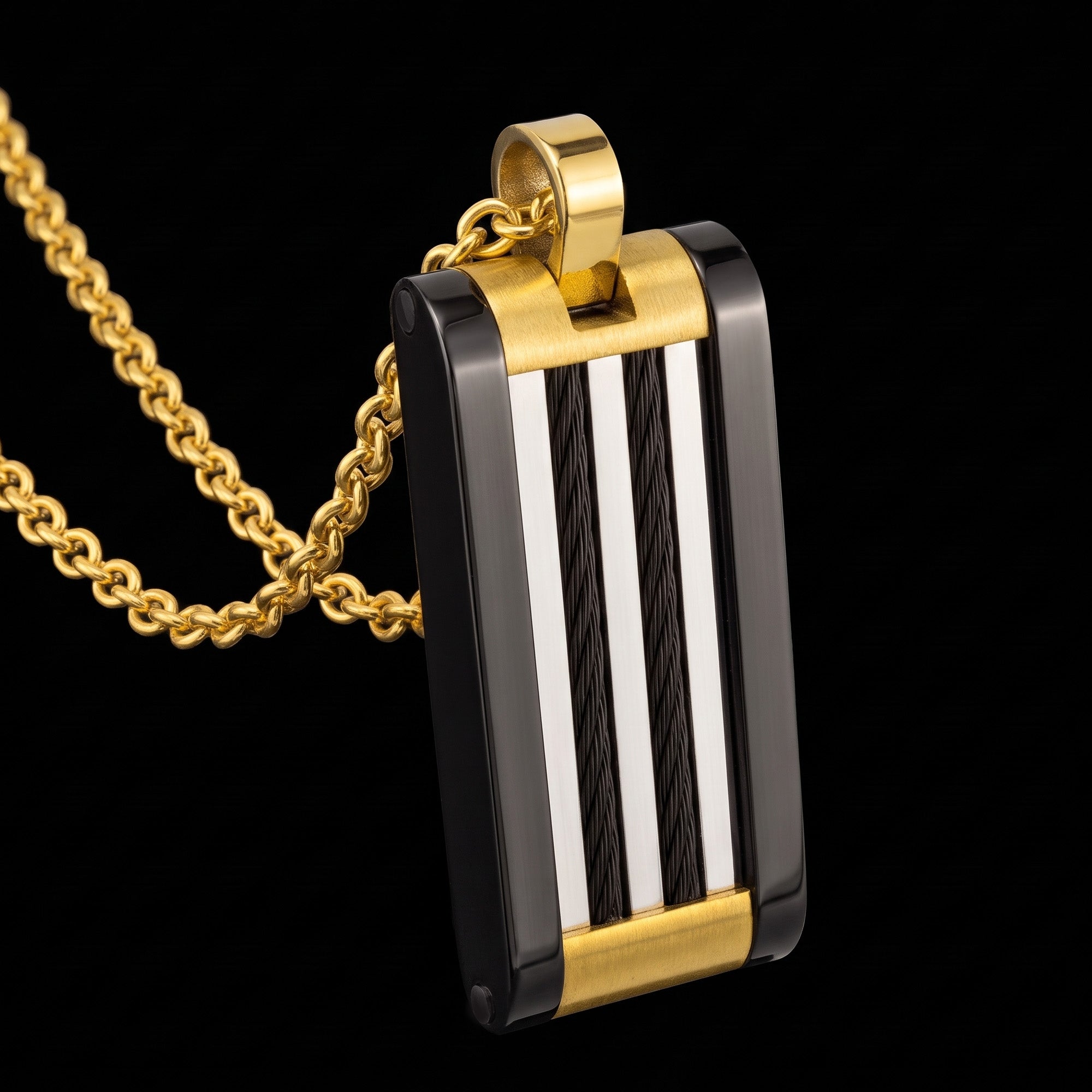 A black and gold steel cable dog tag men's necklace tilted to the right.