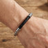 Man wearing Maximan Midnight men's black leather steel chain bracelet