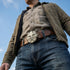 Man wearing a belt with a Celtic green man face belt buckle.