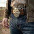 Close-up of man's waist wearing a belt with a Celtic green man face belt buckle.