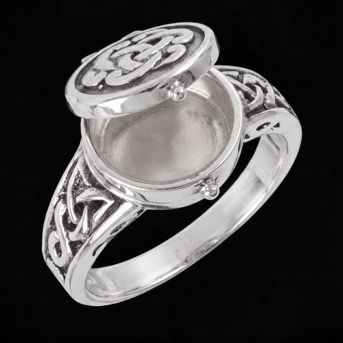 Celtic sterling silver poison ring in the open position to reveal a hidden compartment.