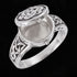 Celtic sterling silver poison ring in the open position to reveal a hidden compartment.