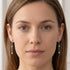 Woman wearing a pair of Engelsrufer chain sterling silver CZ earrings.