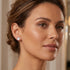 Woman wearing Engelsrufer circle pave CZ sterling silver earrings.