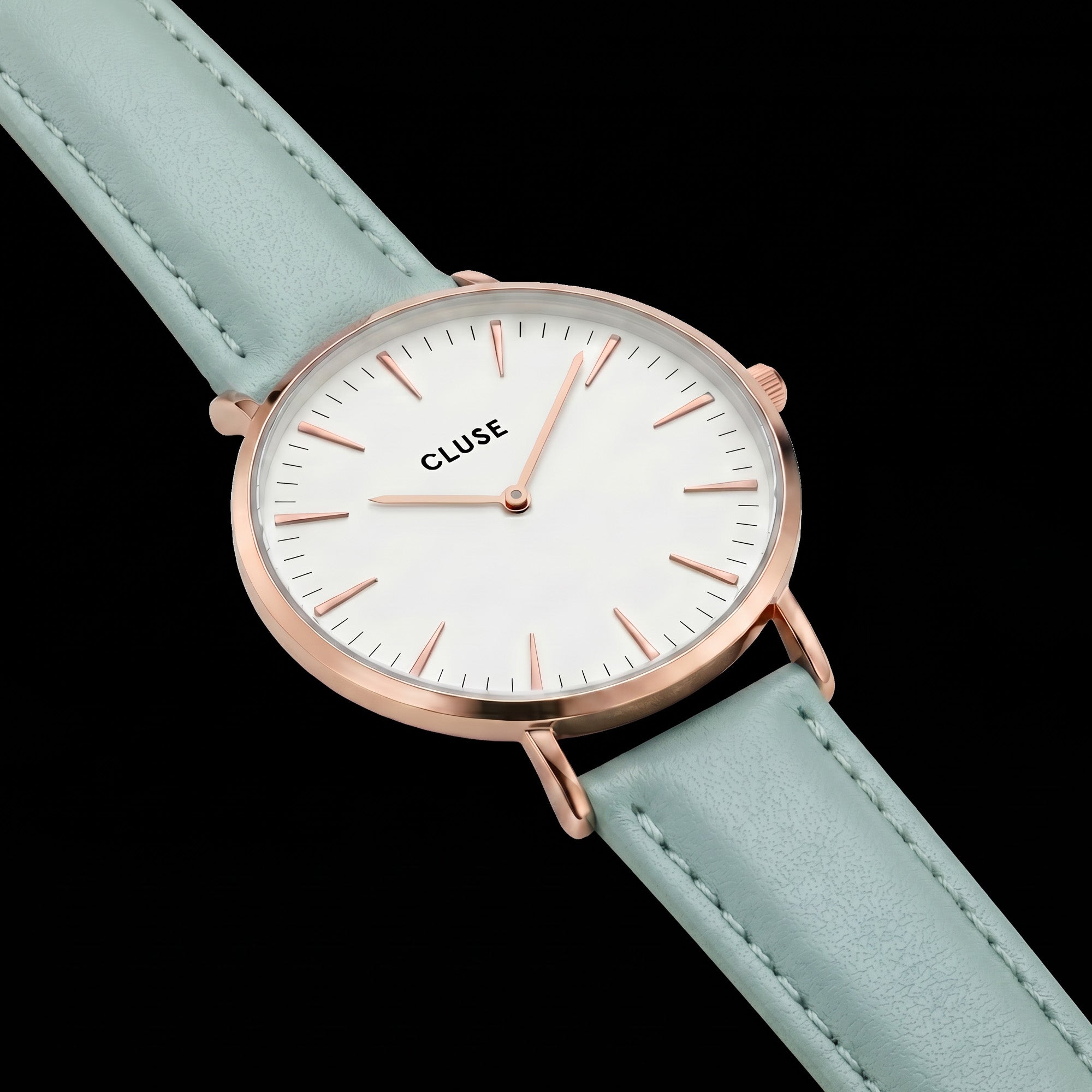 Close-up of a Cluse La Boheme rose gold white/pastel mint green watch.